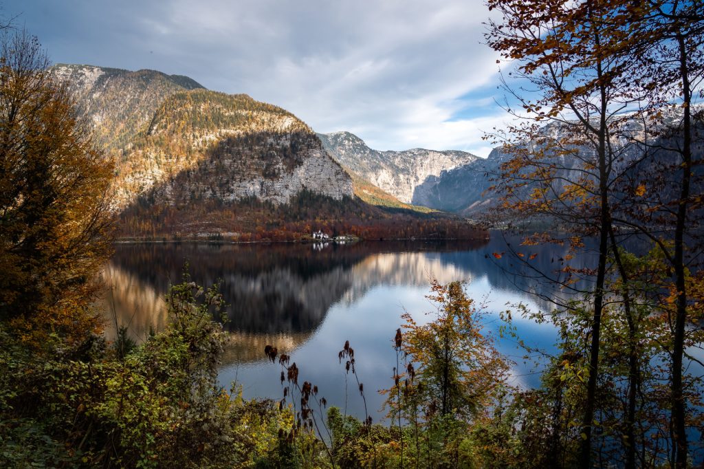 Autumn aerial view of Hallstatt Lake with Obertraun, Schloss Grub and Mountains - Hallstatt, Austria